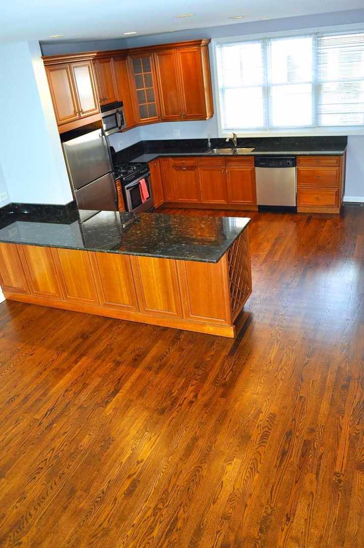 1765 West Altgeld Street, Unit M Chicago, IL 60614 - Photo 5 of 21 a view of a room with wooden floor and chair