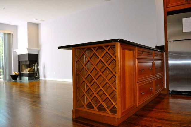 1765 West Altgeld Street, Unit M Chicago, IL 60614 - Photo 10 of 21 a view of an empty room with wooden floor and a cabinet