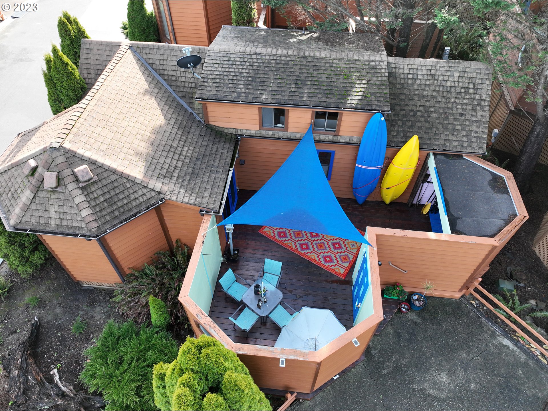 an aerial view of a house with a swimming pool and outdoor space