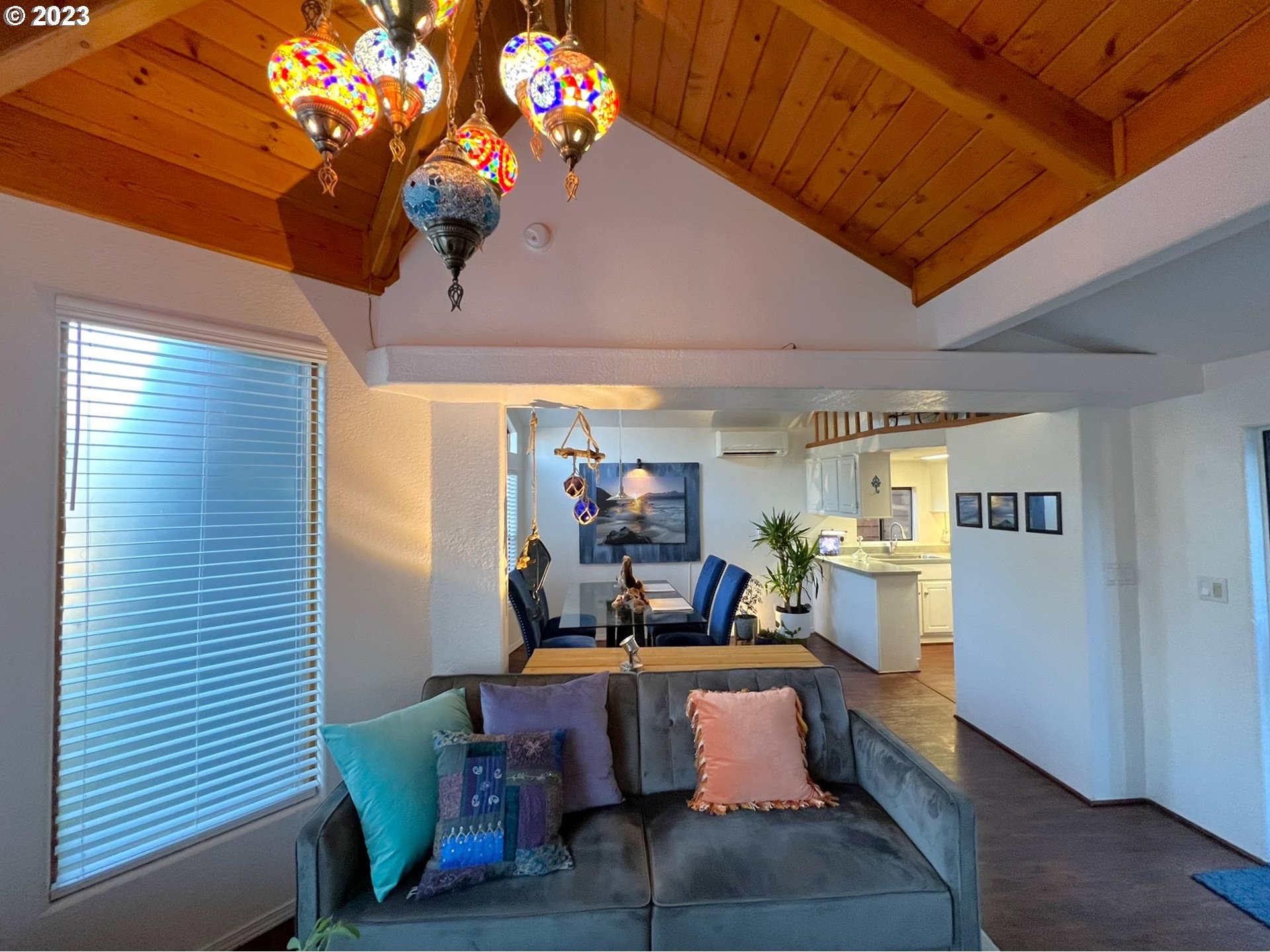 97748 North Bank Chetco River Road, Unit 15 Brookings, OR 97415 - Photo 20 of 48 a living room with furniture and a dining room