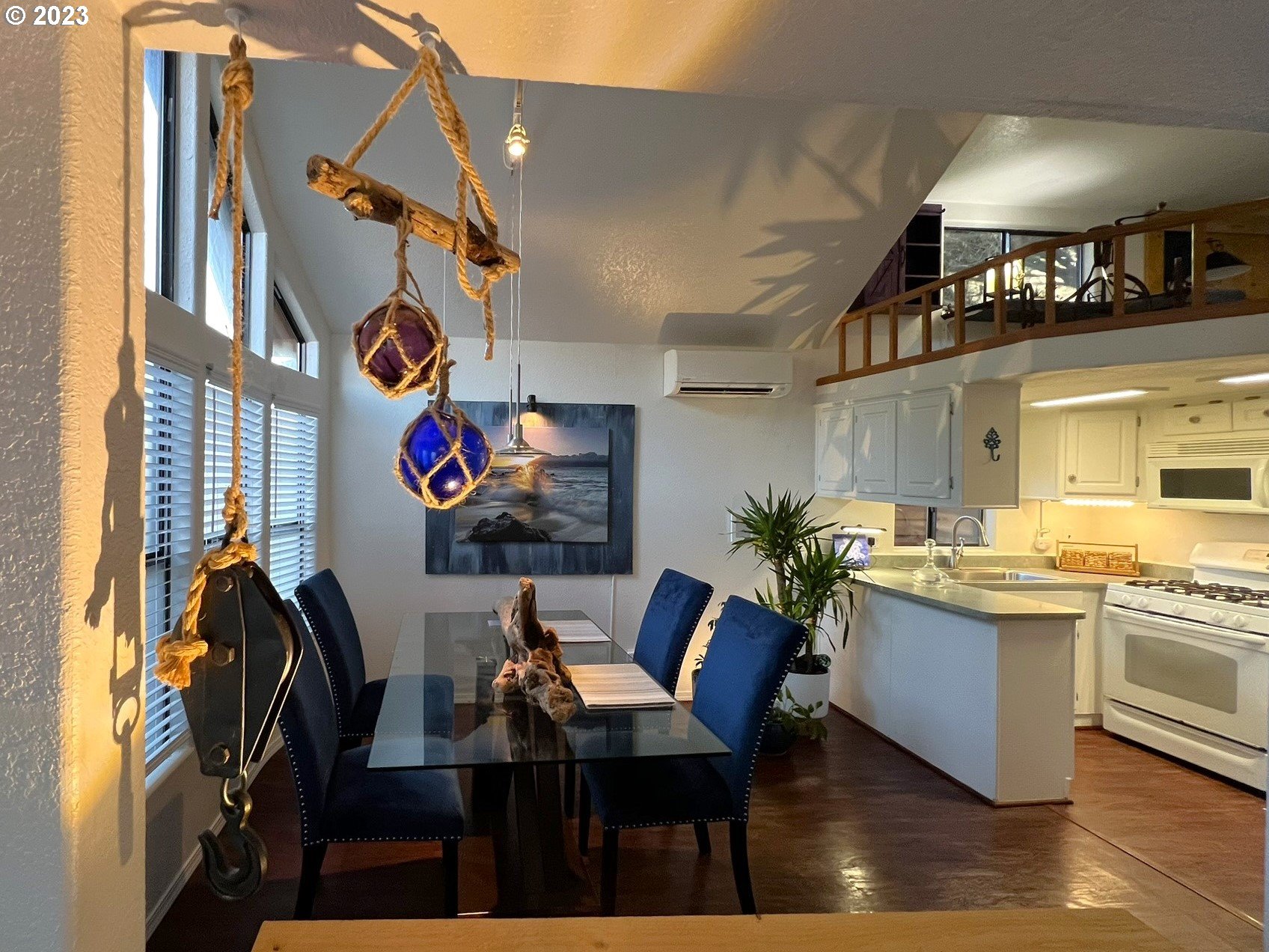 97748 North Bank Chetco River Road, Unit 15 Brookings, OR 97415 - Photo 22 of 48 a view of a dining room with furniture kitchen and wooden floor