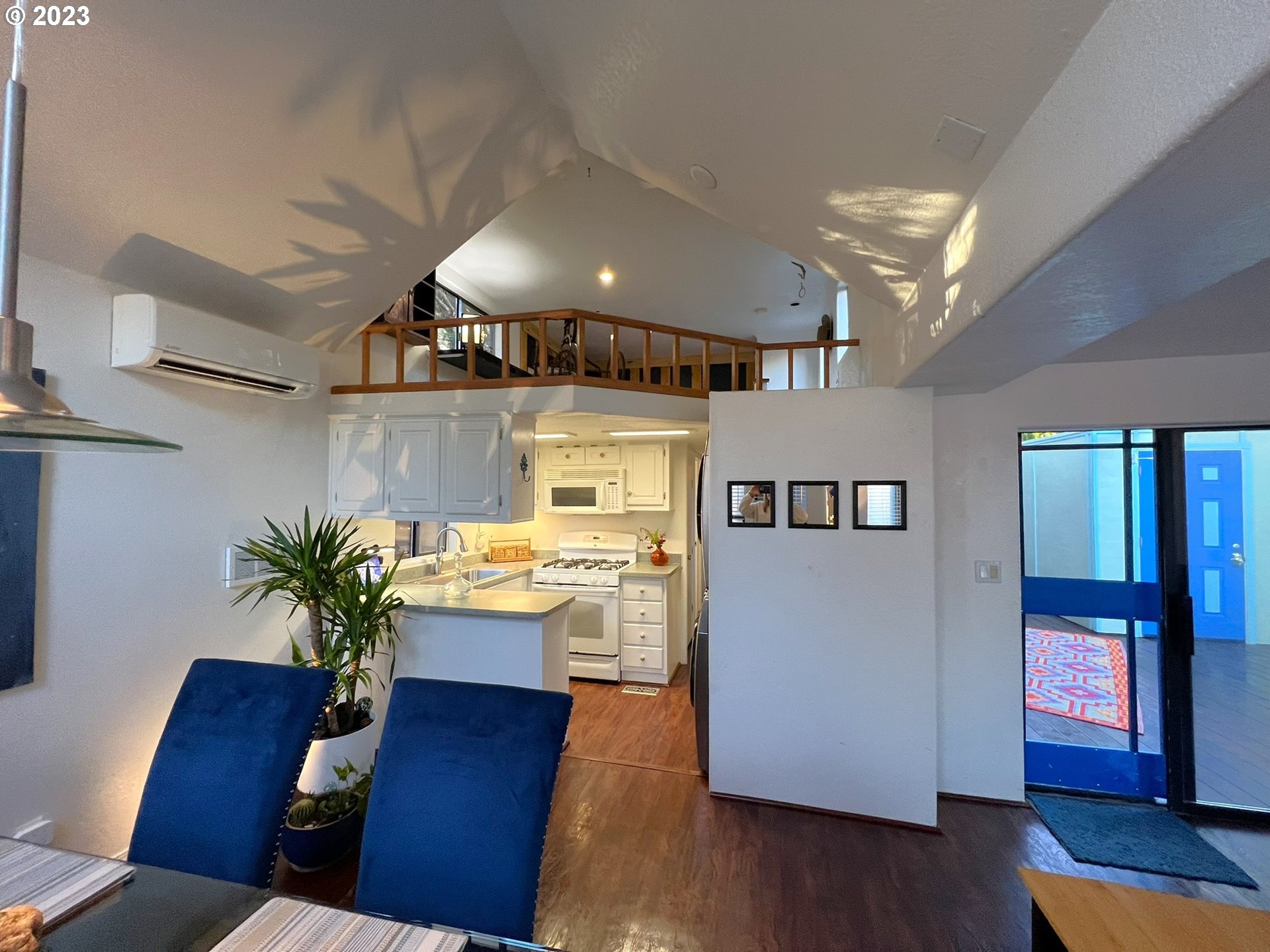 97748 North Bank Chetco River Road, Unit 15 Brookings, OR 97415 - Photo 28 of 48 a living room with furniture and a wooden floor