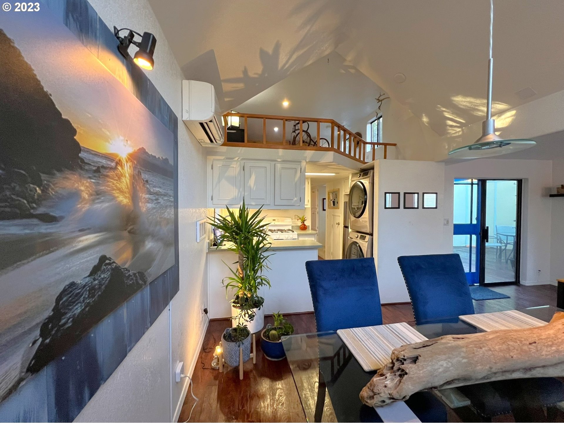 97748 North Bank Chetco River Road, Unit 15 Brookings, OR 97415 - Photo 29 of 48 a living room with furniture and a chandelier