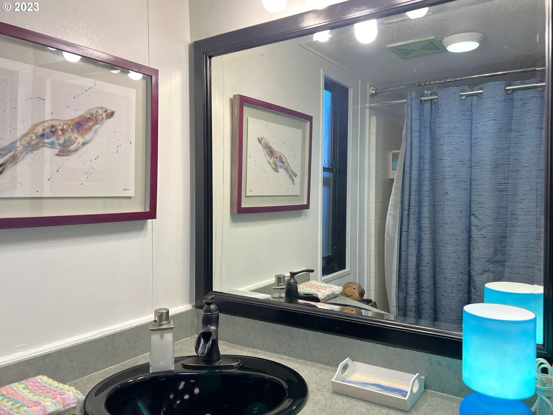 97748 North Bank Chetco River Road, Unit 15 Brookings, OR 97415 - Photo 41 of 48 a bathroom with a sink a toilet and a mirror