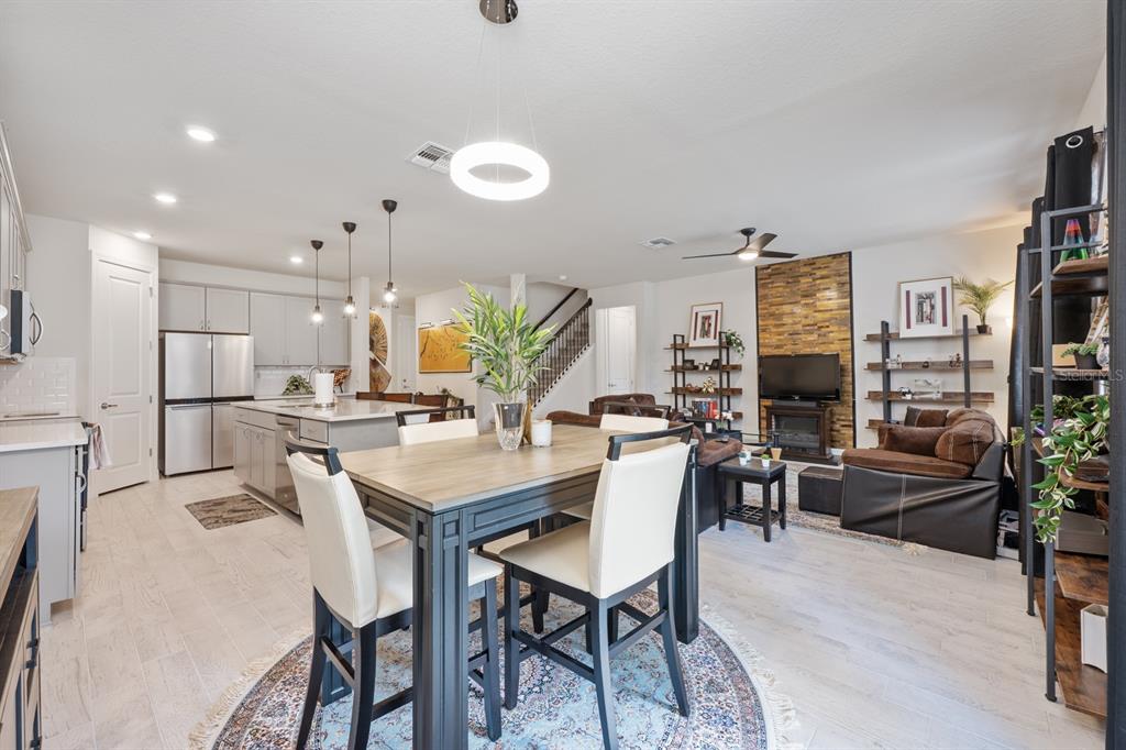 2713 Hilltop Loop Apopka, FL 32712 - Photo 16 of 54 a view of a dining room with furniture