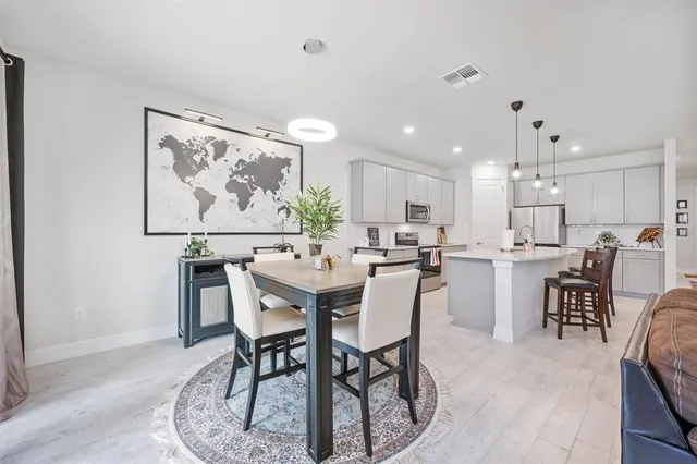 a view of a dining room with furniture window and outside view