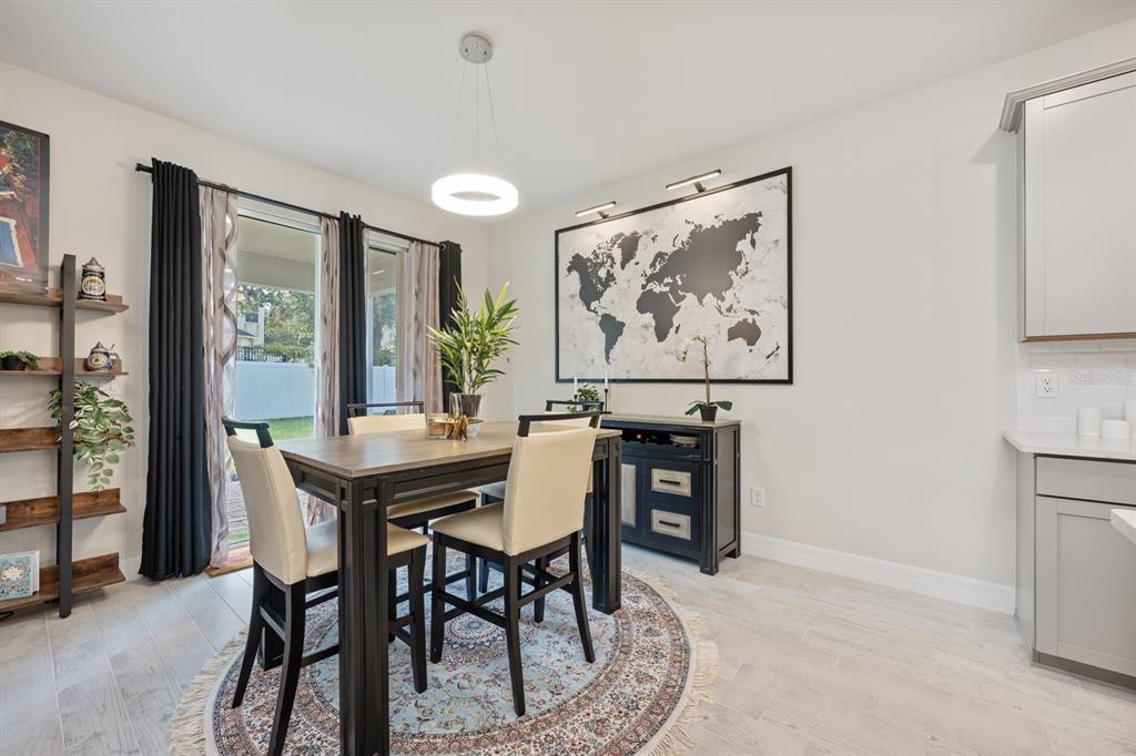 2713 Hilltop Loop Apopka, FL 32712 - Photo 18 of 54 a view of a dining room with furniture window and outside view