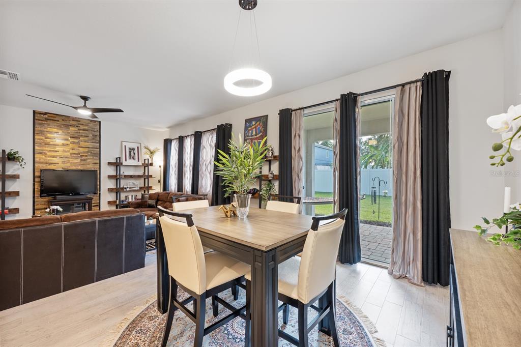 2713 Hilltop Loop Apopka, FL 32712 - Photo 22 of 54 a view of a dining room with furniture window and outside view