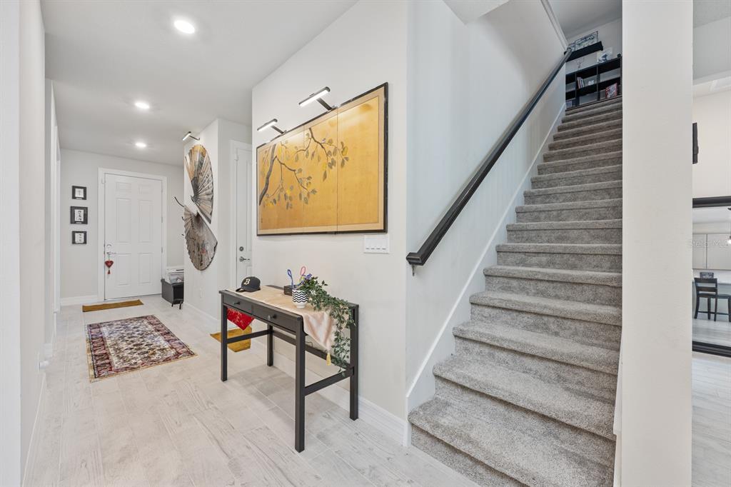 2713 Hilltop Loop Apopka, FL 32712 - Photo 23 of 54 a view of entryway and hall with wooden floor