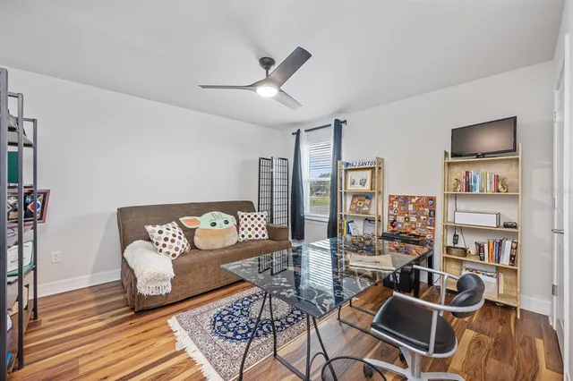 a bathroom with a sink a toilet a mirror a vanity and shower