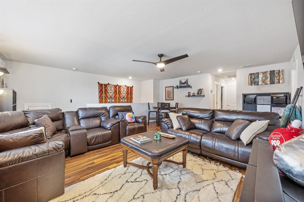 2713 Hilltop Loop Apopka, FL 32712 - Photo 40 of 54 a living room with furniture and a rug