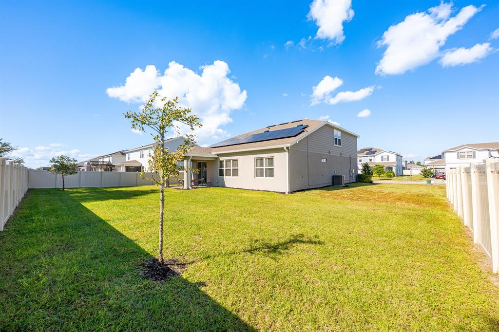 2713 Hilltop Loop Apopka, FL 32712 - Photo 4 of 54 a swimming pool with yard and outdoor seating
