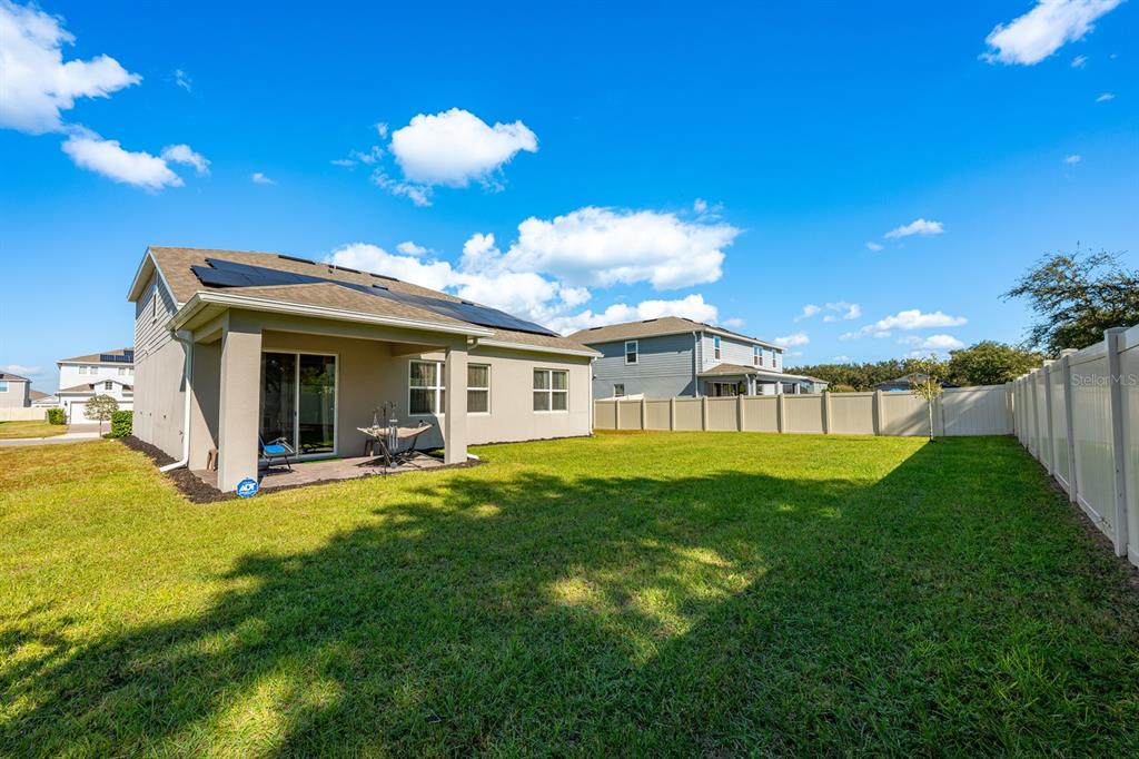 2713 Hilltop Loop Apopka, FL 32712 - Photo 7 of 54 a view of a house with a yard and porch