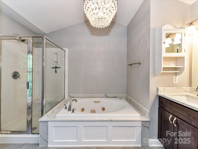 a white bath tub sitting next to a window
