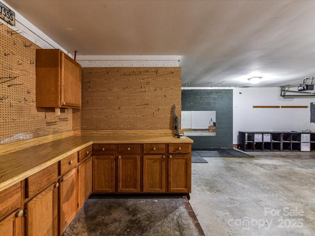 a kitchen with stainless steel appliances granite countertop a sink and a stove