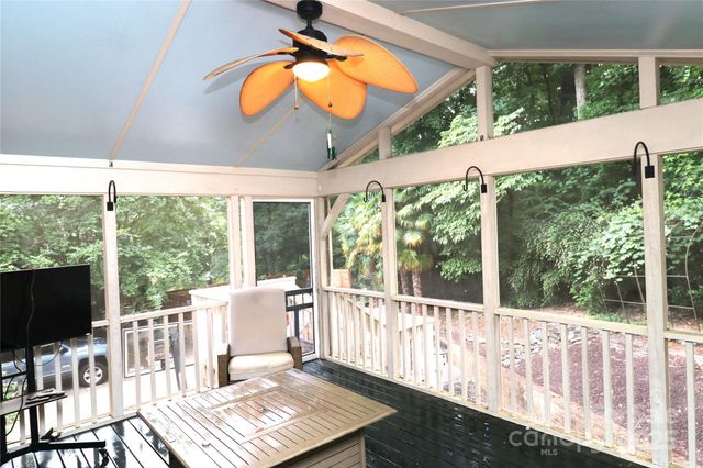 a view of a balcony with furniture