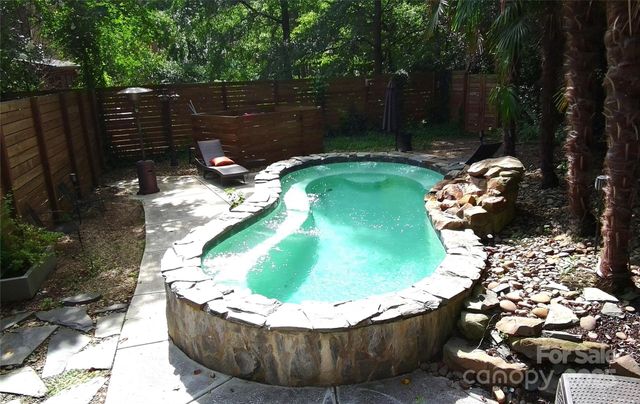 a view of a wooden tub with a yard