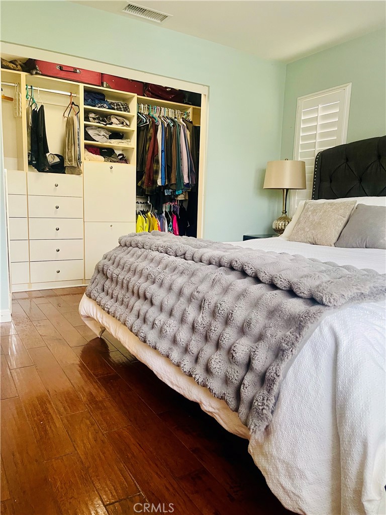 11 Georgia Irvine, CA 92606 - Photo 23 of 27 a bedroom with a bed and flat tv screen