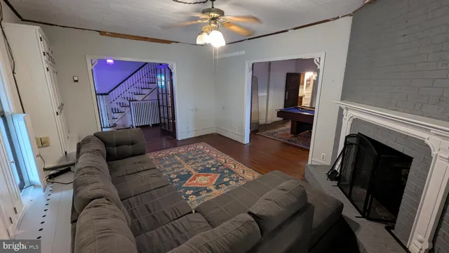 a room with furniture pool table and windows