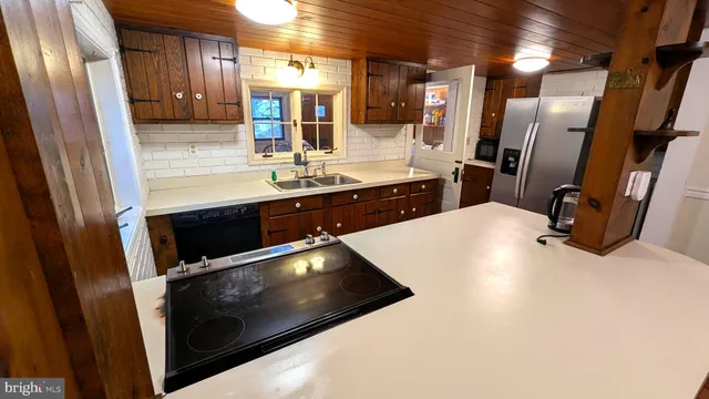 a room with pool table and a chandelier