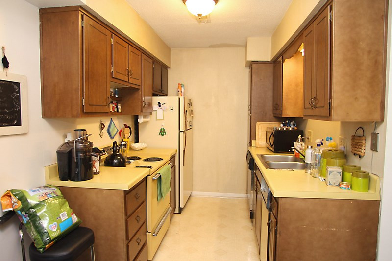 Galley Kitchen, Vinyl Floor, Refrigerator. Kitchen