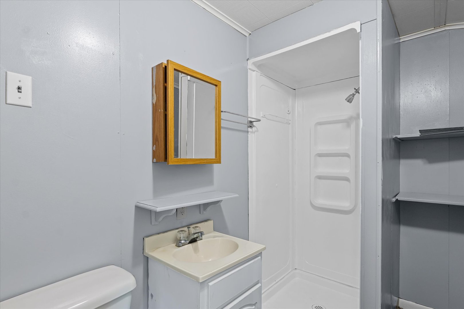 33 State Street Danville, IL 61832 - Photo 15 of 29 a bathroom with a toilet sink and mirror