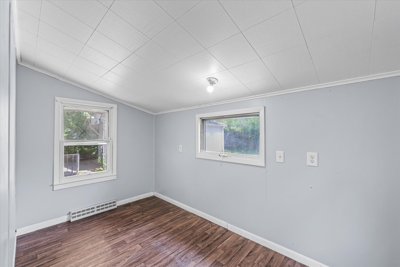 33 State Street Danville, IL 61832 - Photo 16 of 29 a view of an empty room with a window and wooden floor