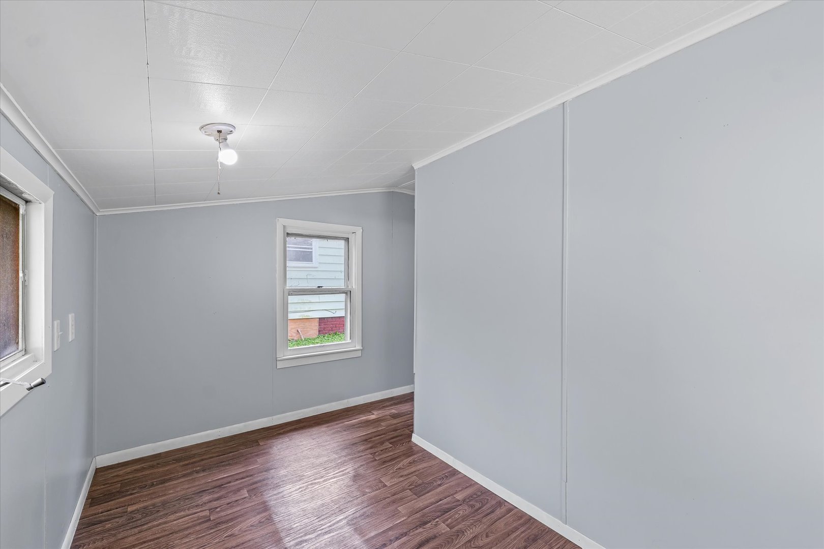 33 State Street Danville, IL 61832 - Photo 17 of 29 an empty room with wooden floor and windows