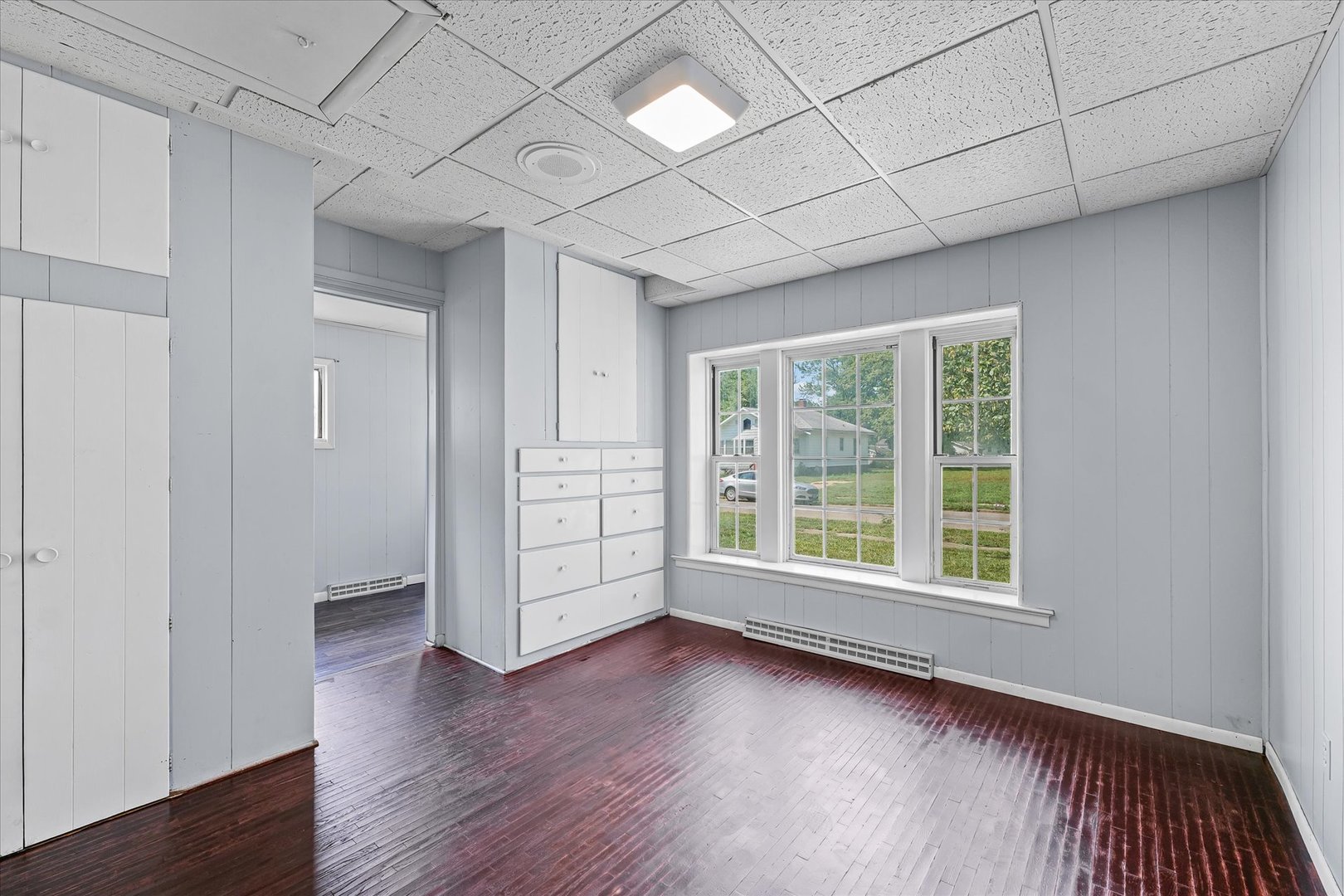 33 State Street Danville, IL 61832 - Photo 18 of 29 a view of a livingroom with wooden floor and window