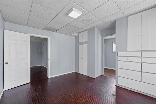 a view of an empty room and wooden floor