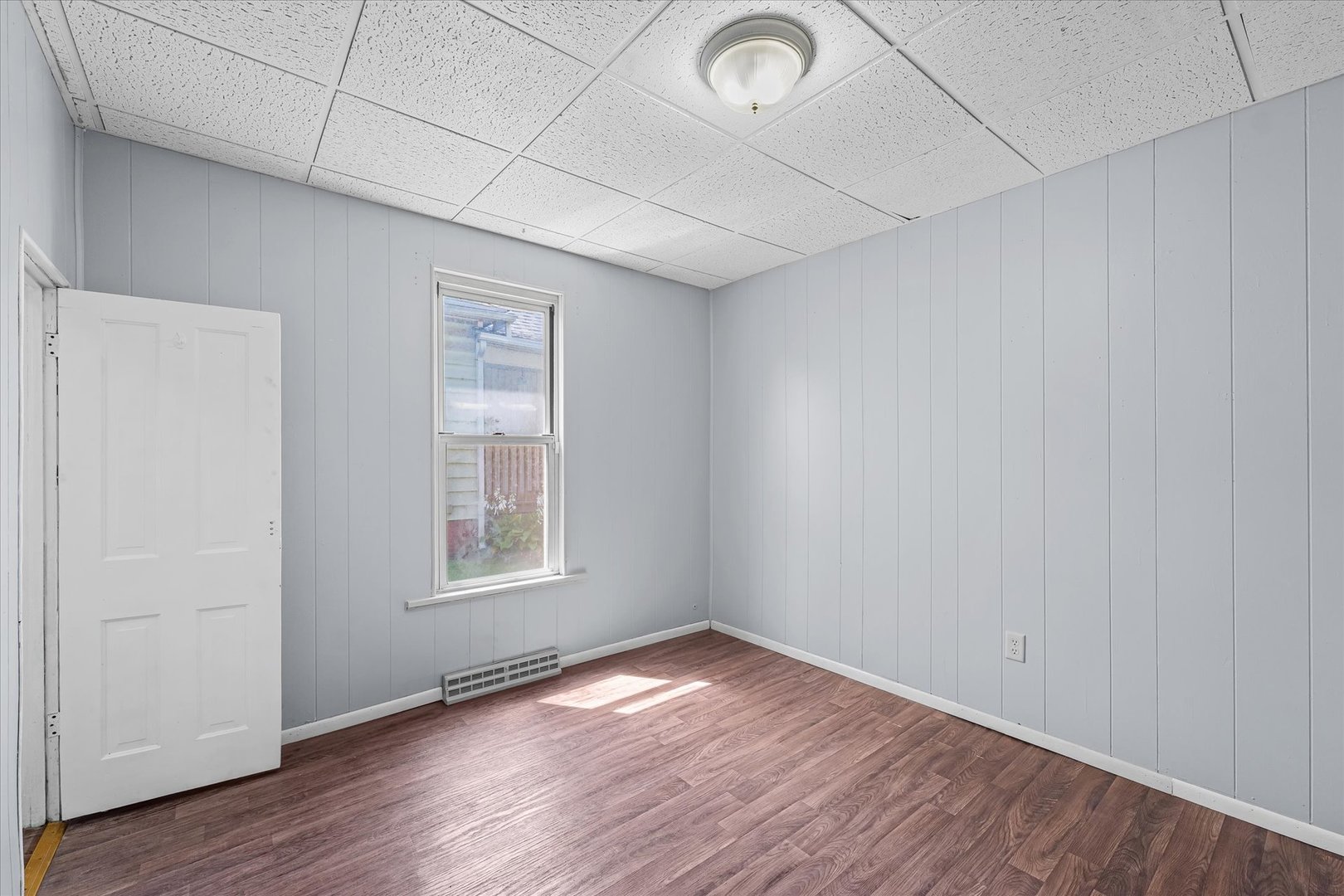33 State Street Danville, IL 61832 - Photo 22 of 29 an empty room with wooden floor and windows