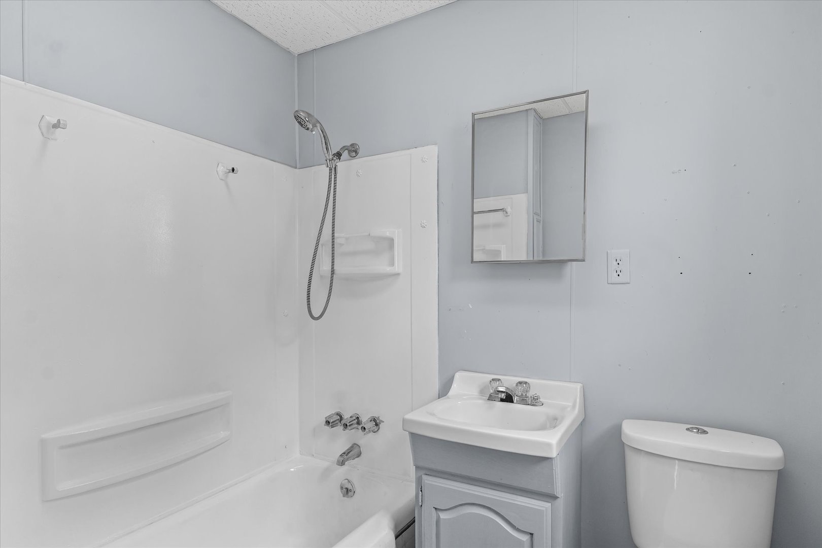 33 State Street Danville, IL 61832 - Photo 24 of 29 a bathroom with a sink a toilet and shower