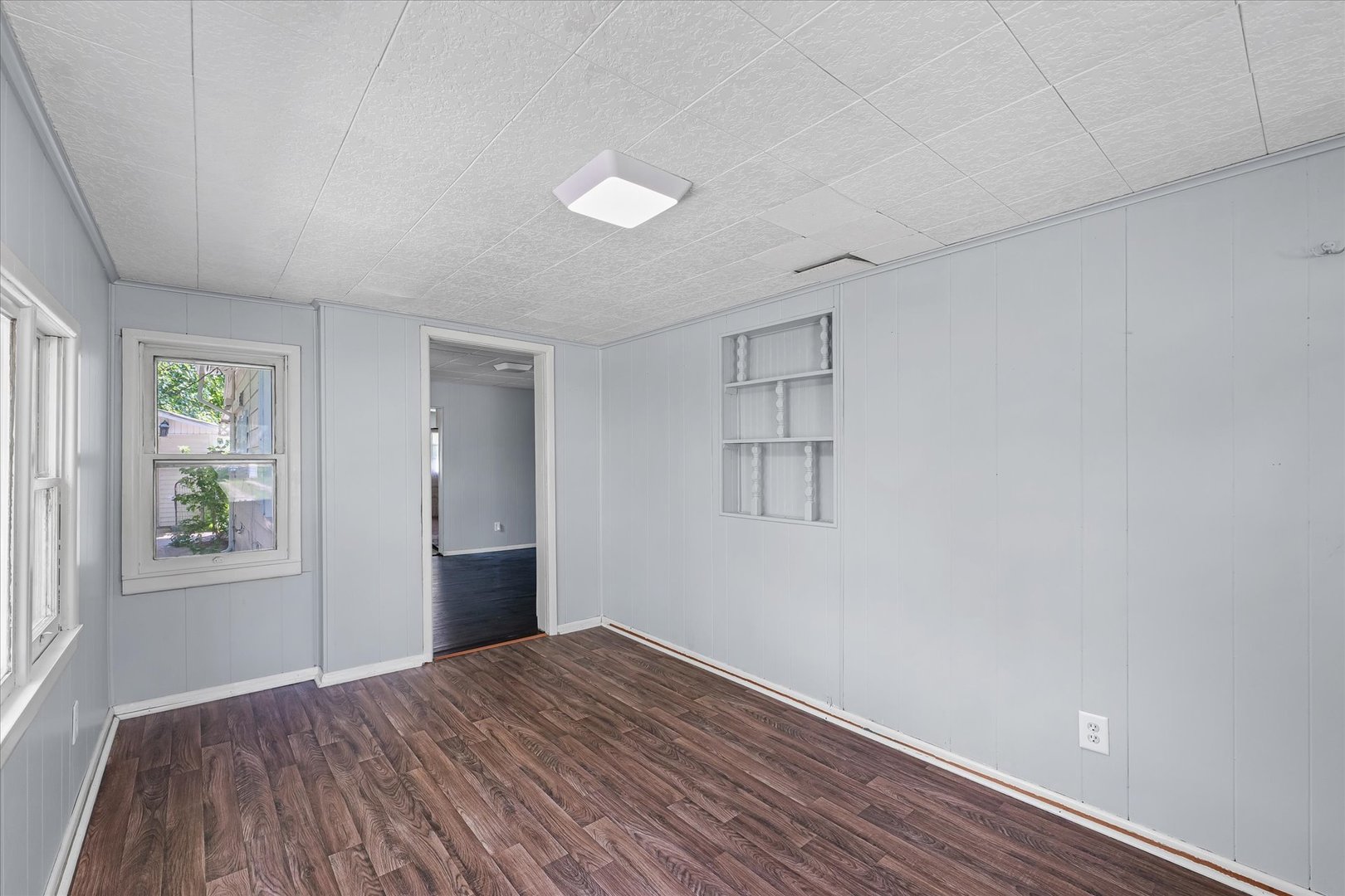 33 State Street Danville, IL 61832 - Photo 5 of 29 wooden floor in an empty room with a window