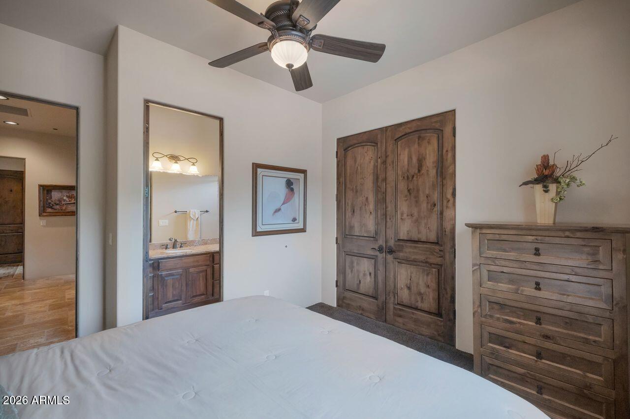18507 East Picacho Road Rio Verde, AZ 85263 - Photo 26 of 33 a bedroom with a bed and a dresser
