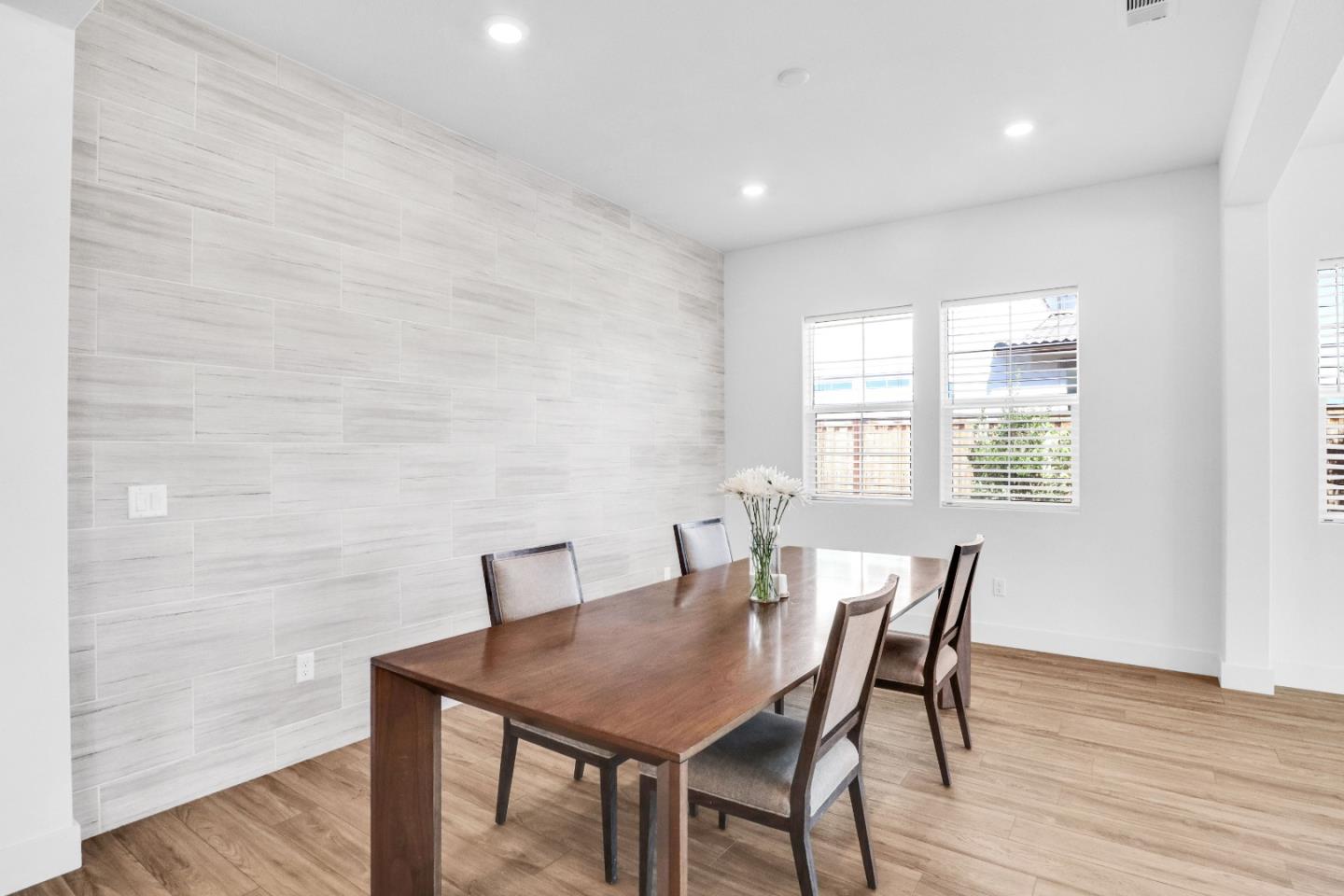 6326 Moser Way Tracy, CA 95377 - Photo 11 of 45 a view of a dining room with furniture and wooden floor