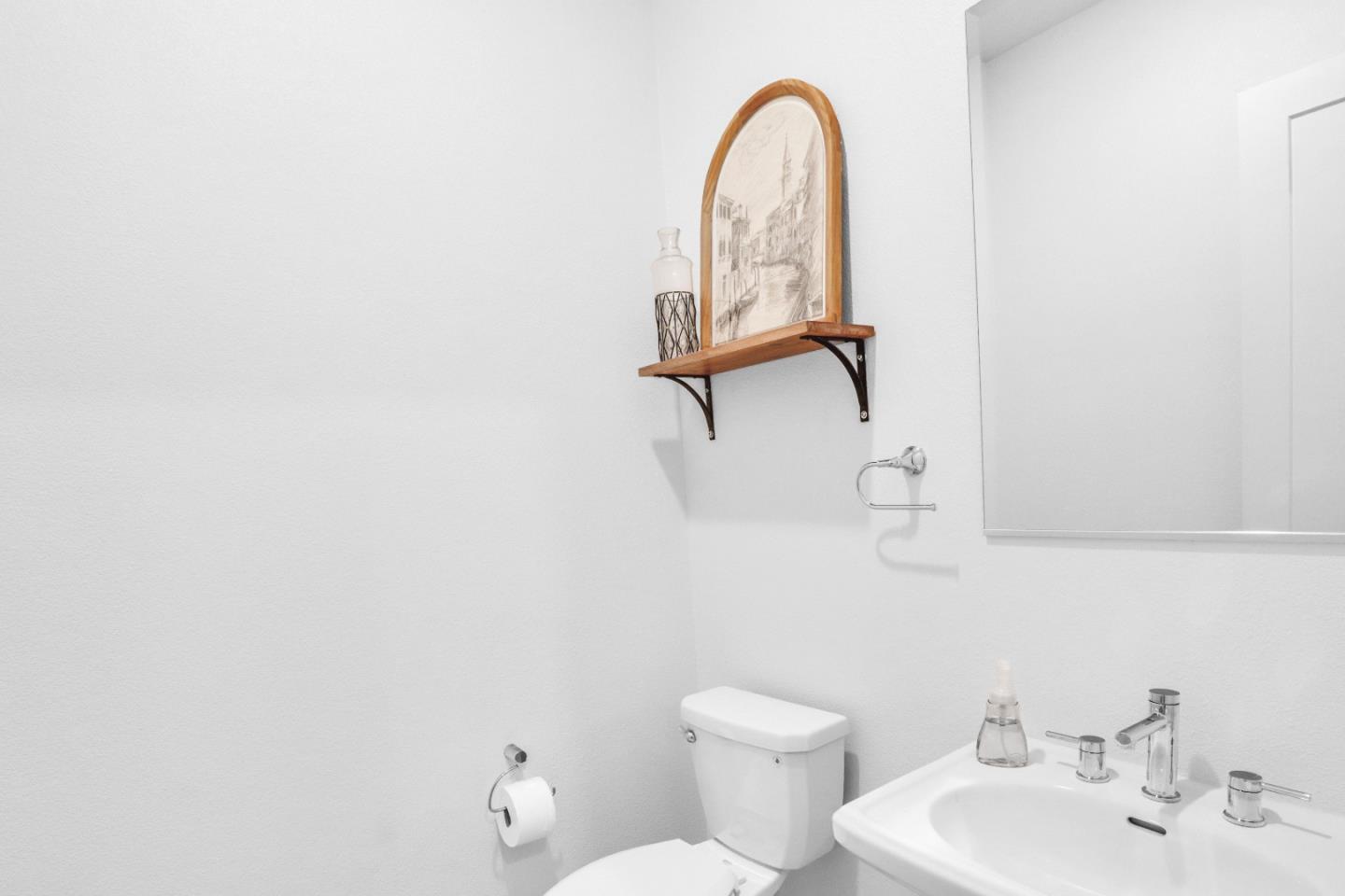 6326 Moser Way Tracy, CA 95377 - Photo 28 of 45 a bathroom with a toilet sink and mirror