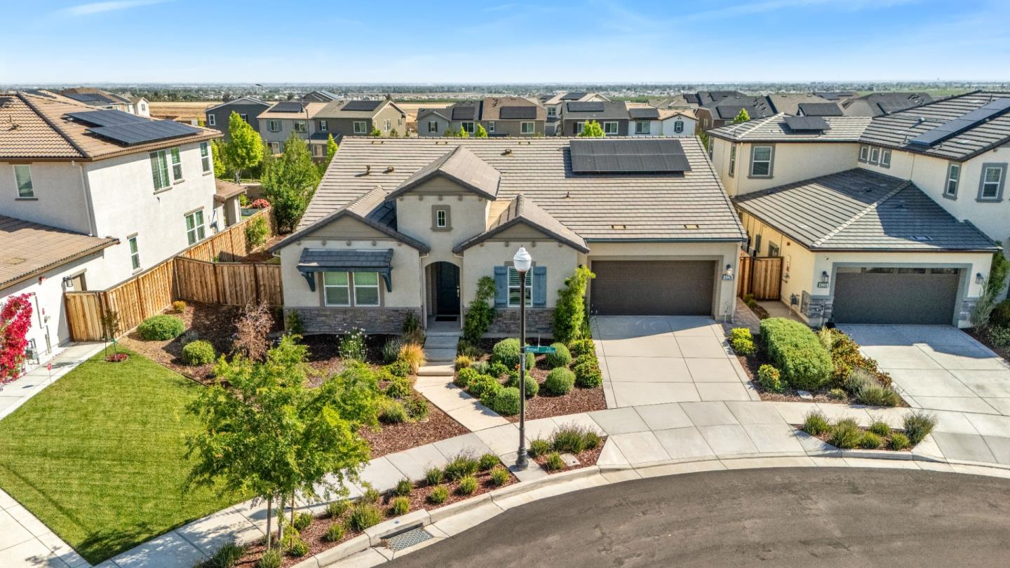 6326 Moser Way Tracy, CA 95377 - Photo 3 of 45 an aerial view of a house with a yard and potted plants
