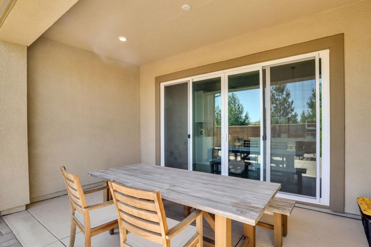 6326 Moser Way Tracy, CA 95377 - Photo 35 of 45 a dining room with a table and chairs