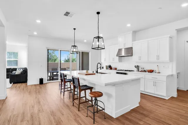 a view of kitchen with cabinets and wooden floor