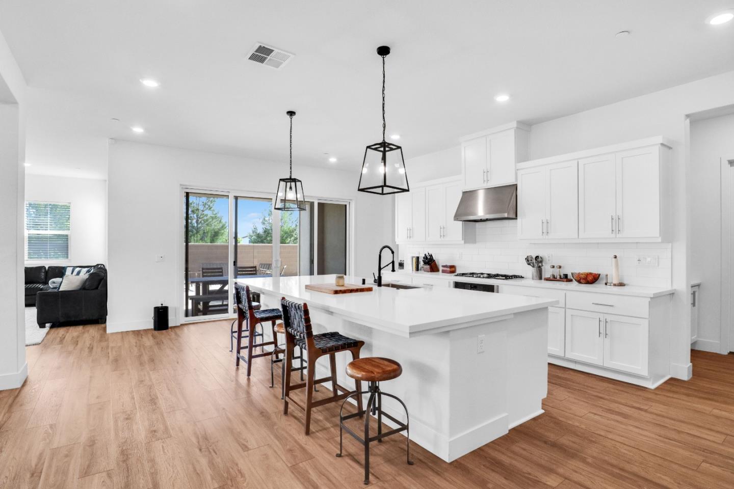 6326 Moser Way Tracy, CA 95377 - Photo 8 of 45 a view of kitchen with cabinets and wooden floor