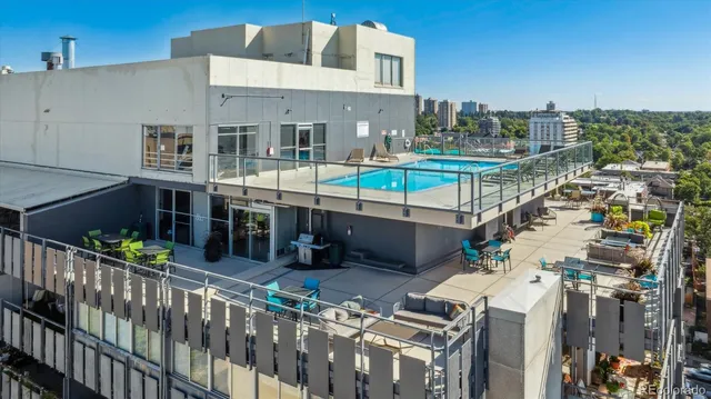 a view of a terrace with furniture and stove