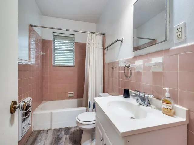 a bathroom with a sink toilet bathtub and vanity