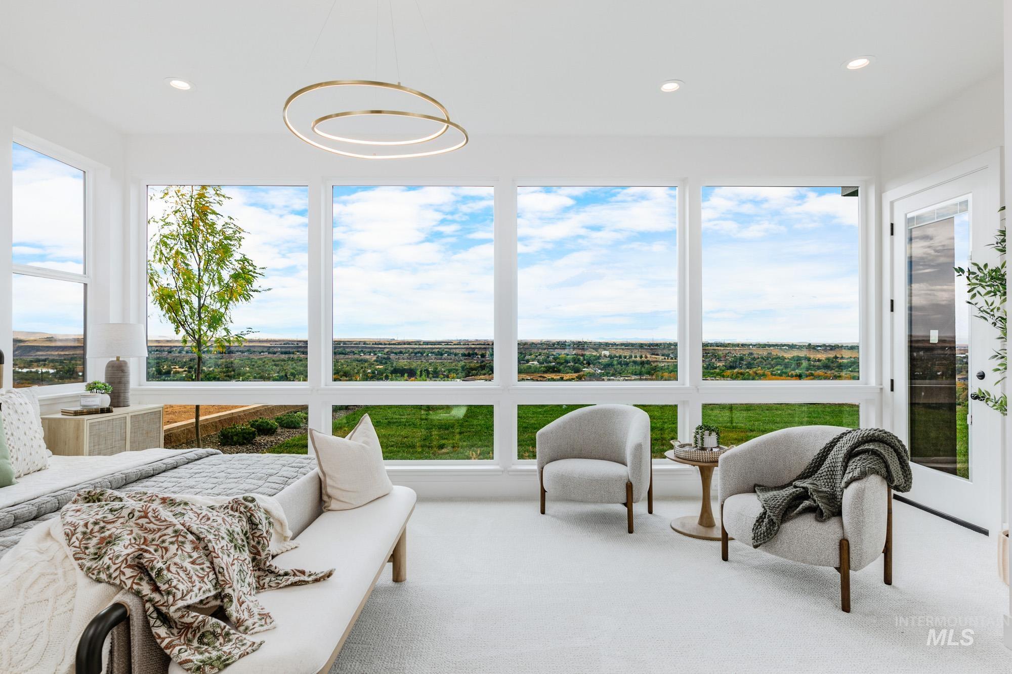 6177 East Prominence Drive Boise, ID 83716 - Photo 19 of 45 Sunroom / solarium featuring plenty of natural light, recessed lighting, and carpet floors