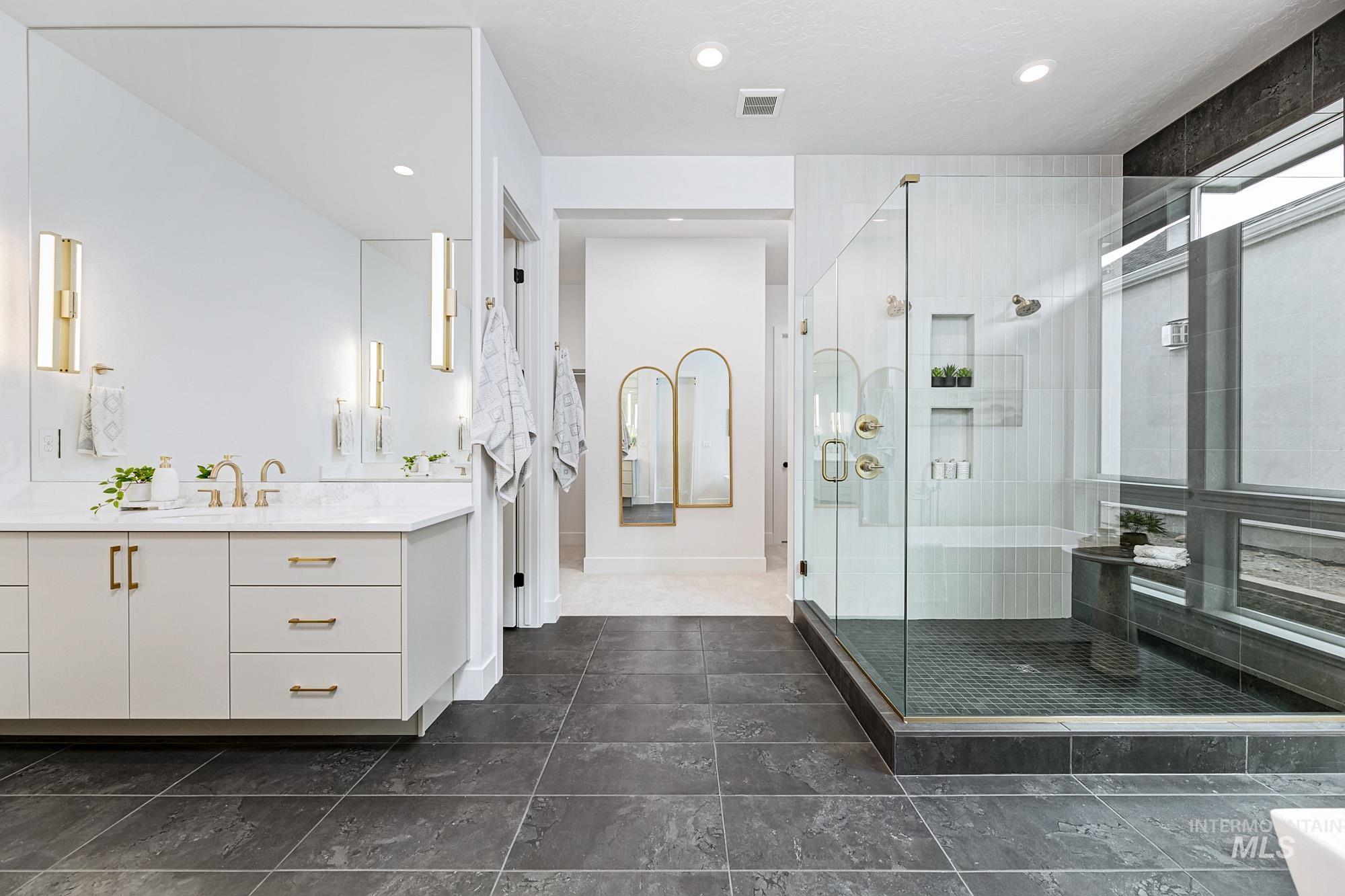 6177 East Prominence Drive Boise, ID 83716 - Photo 21 of 45 Bathroom featuring a shower stall, vanity, and recessed lighting