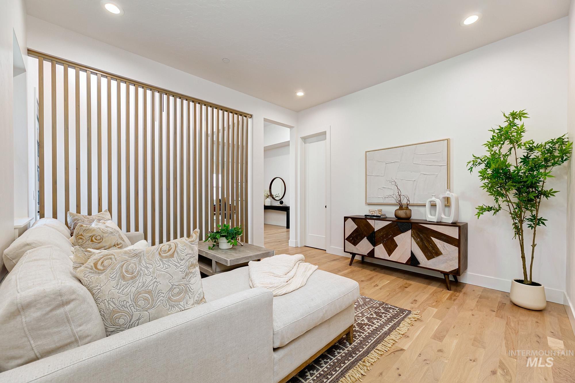 6177 East Prominence Drive Boise, ID 83716 - Photo 29 of 45 Living room featuring light wood-style floors and recessed lighting