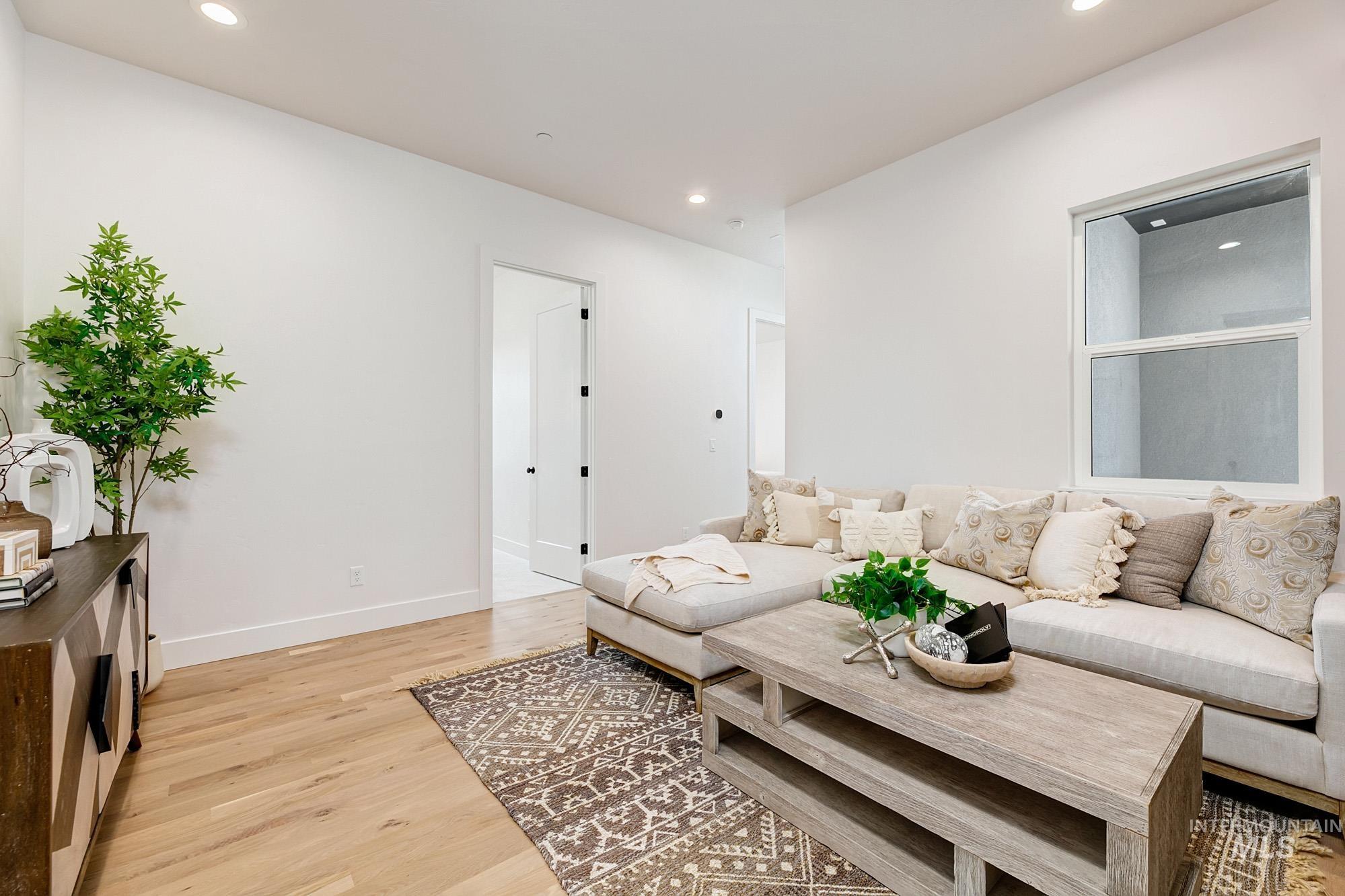 6177 East Prominence Drive Boise, ID 83716 - Photo 30 of 45 Living area with light wood finished floors and recessed lighting