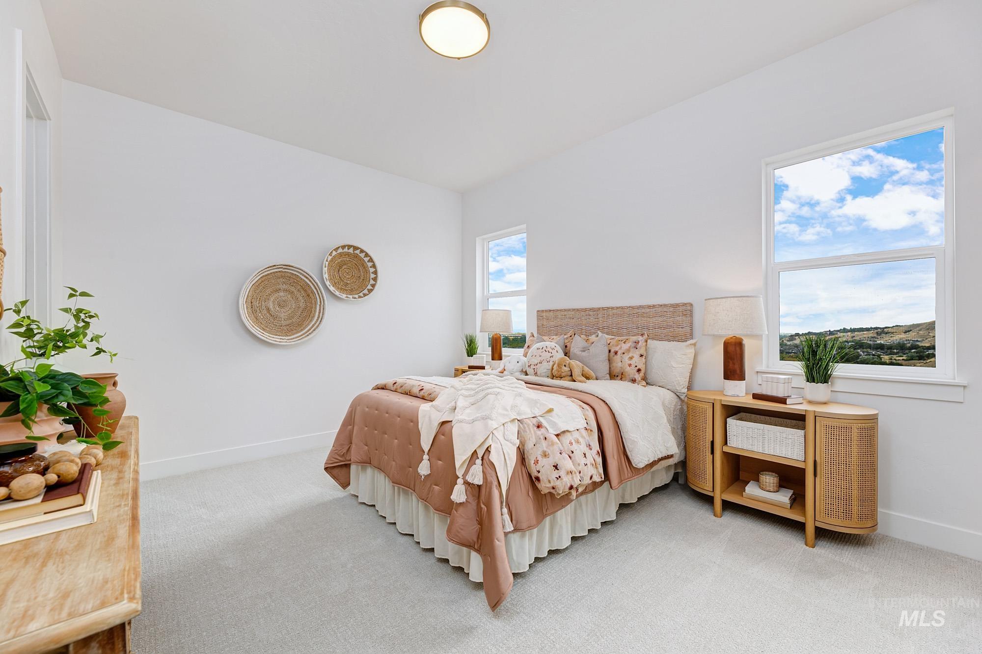 6177 East Prominence Drive Boise, ID 83716 - Photo 31 of 45 Carpeted bedroom featuring baseboards