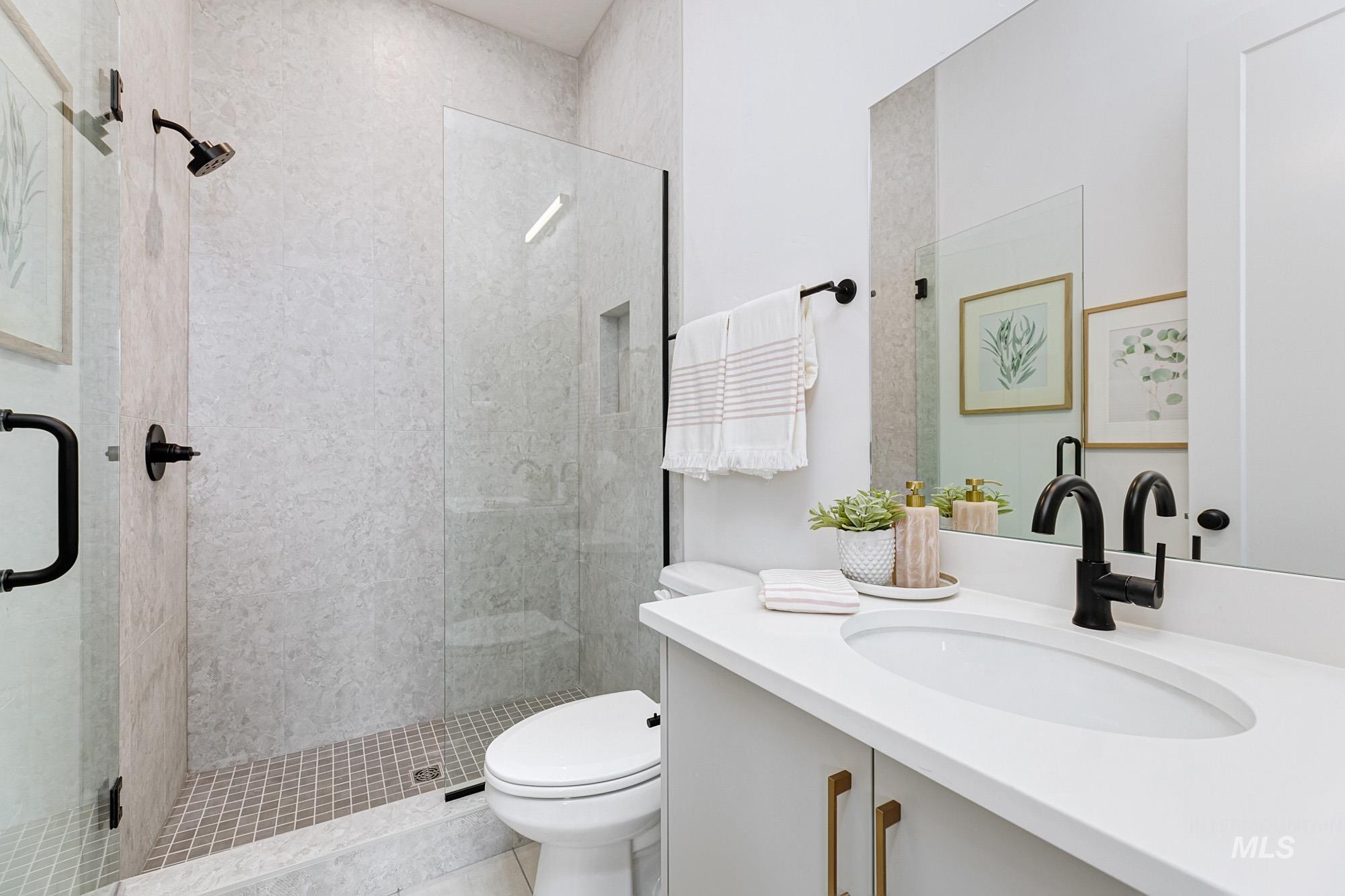 6177 East Prominence Drive Boise, ID 83716 - Photo 32 of 45 Full bathroom with a stall shower and vanity