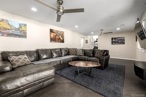 a living room with furniture and a rug