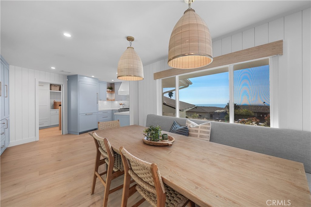 1805 Arriba Linda San Clemente, CA 92672 - Photo 13 of 50 a kitchen with stainless steel appliances a dining table chairs and stove